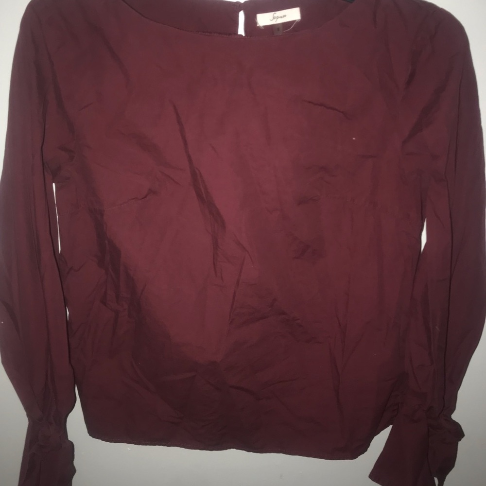 Maroon shirt.